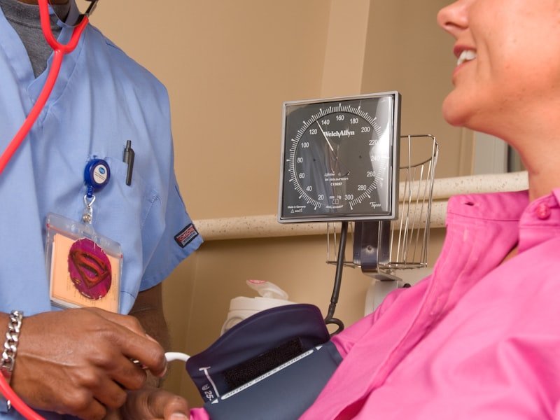Registered physiotherapist conducting a hands-on initial clinical assessment with a patient