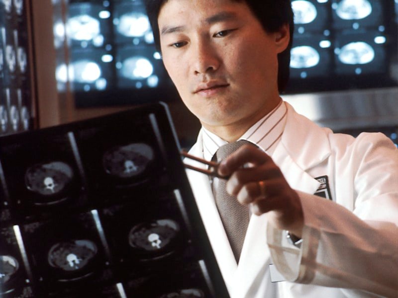 Clinician reviewing diagnostic imaging — concussion and vestibular assessment context